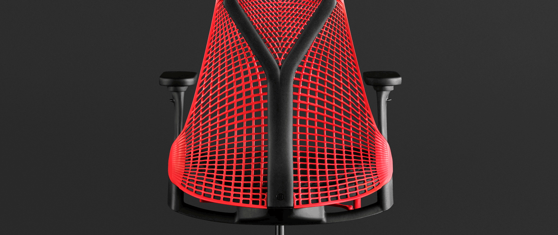 An animation over a photograph of the Sayl Chair in red highlights the benefits of its 3D Intelligent Suspension Back.