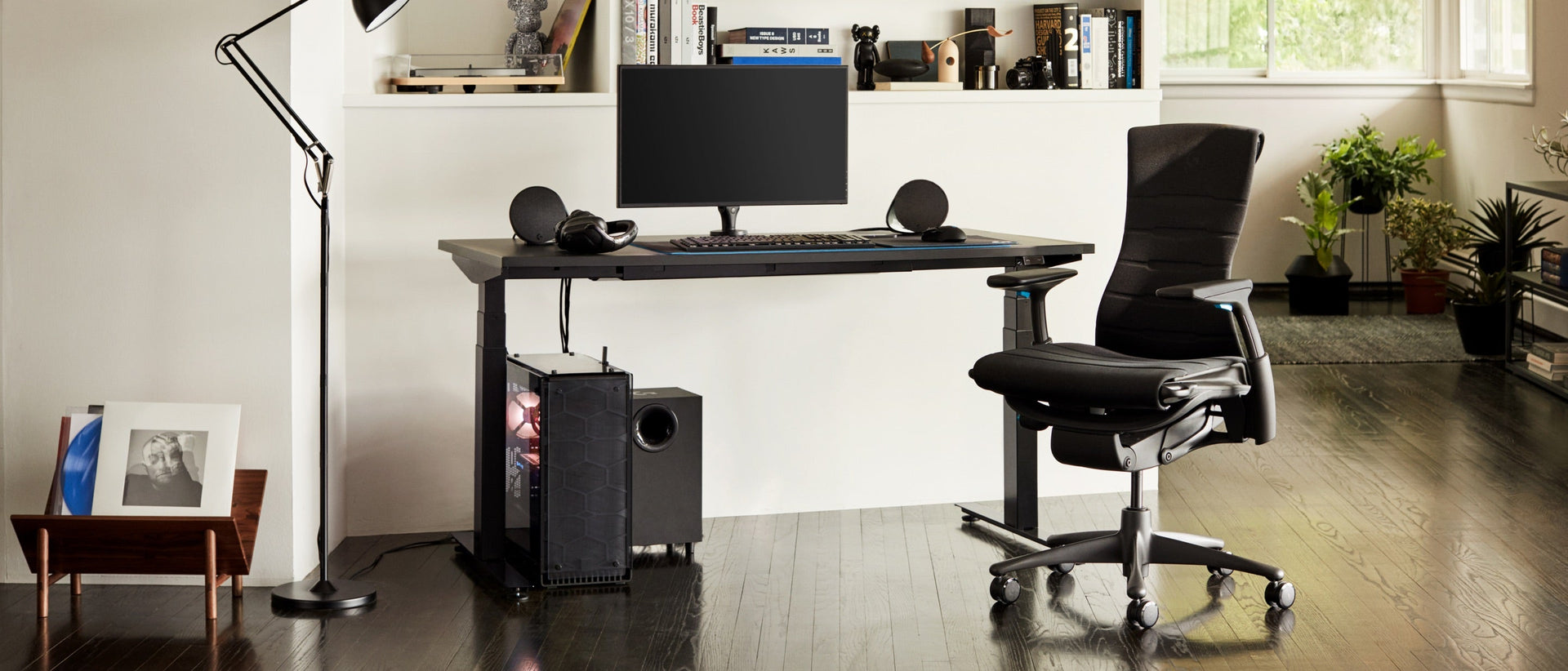 A residential setting features the full set-up, including the Embody Gaming Chair, Ollin Monitor Arm and Motia Gaming Desk, in the daytime.